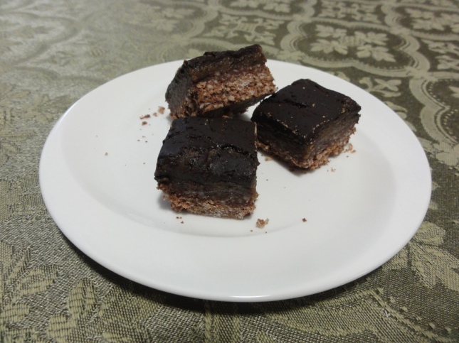 Experimental hypo-allergenic nanaimo bars on a plate
