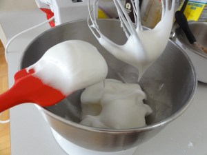 Glossy egg whites on a spatula