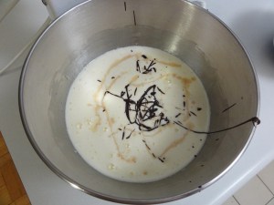 Chocolate and vanilla poured into beaten eggs and sugar