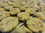 Chocolate chip caramel pecan cookies on a cooling rack