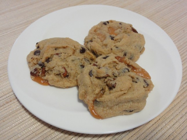 Chocolate chip caramel pecan cookies on a plate