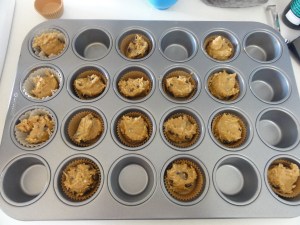 Coconut chocolate chip mini-brownie dough in a pan